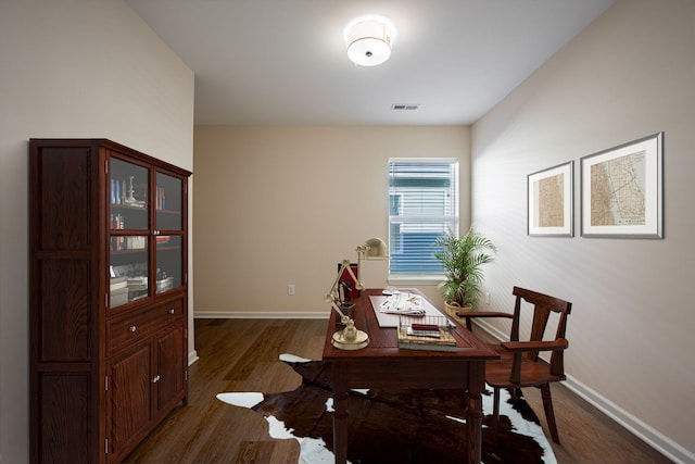 dining area with dark hardwood / wood-style floors