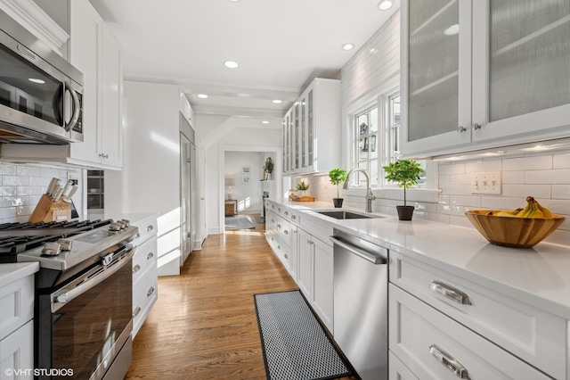 kitchen featuring white cabinetry, appliances with stainless steel finishes, and sink