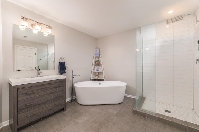 bathroom with vanity and separate shower and tub