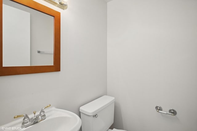 bathroom with toilet and sink