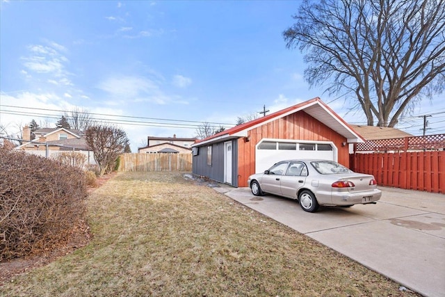 view of property exterior with a garage and a lawn