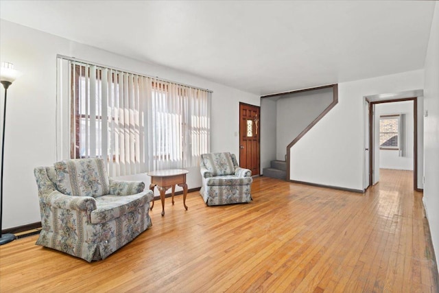 sitting room with hardwood / wood-style flooring