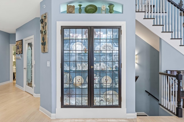 foyer entrance with hardwood / wood-style flooring