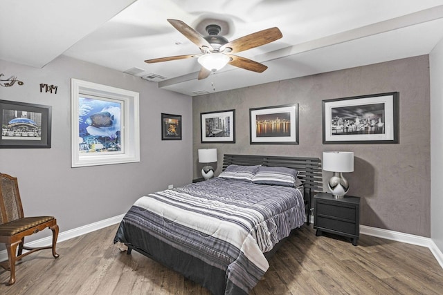 bedroom featuring wood-type flooring and ceiling fan