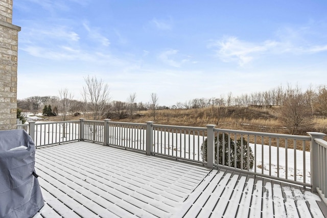 wooden terrace featuring a grill