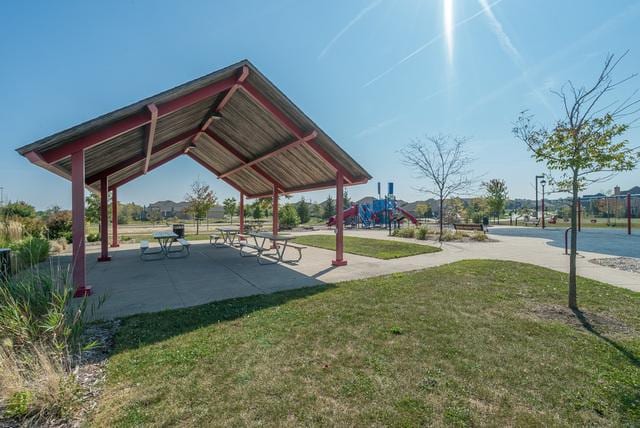 surrounding community featuring a gazebo, a patio, a playground, and a lawn