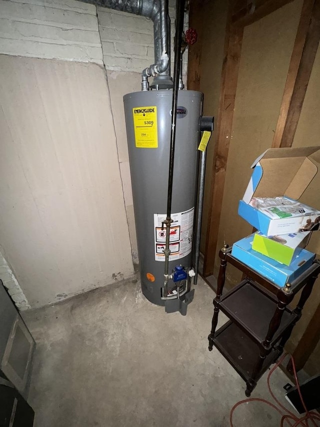 utility room featuring water heater