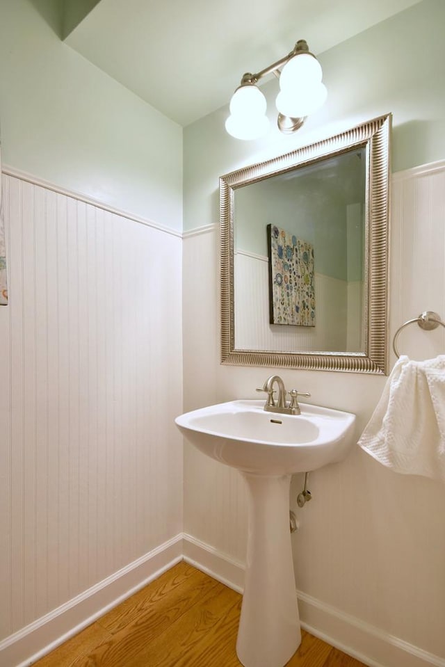 bathroom featuring baseboards and wood finished floors