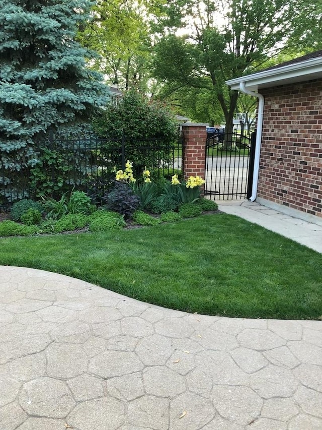 view of yard featuring a gate and fence