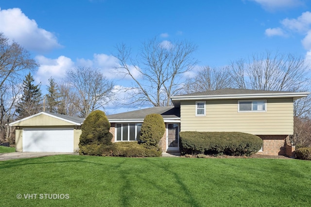 tri-level home with a garage and a front yard