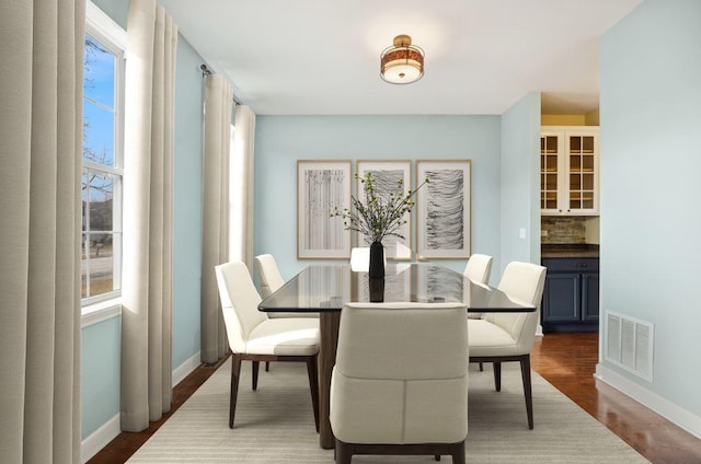 dining area featuring hardwood / wood-style floors