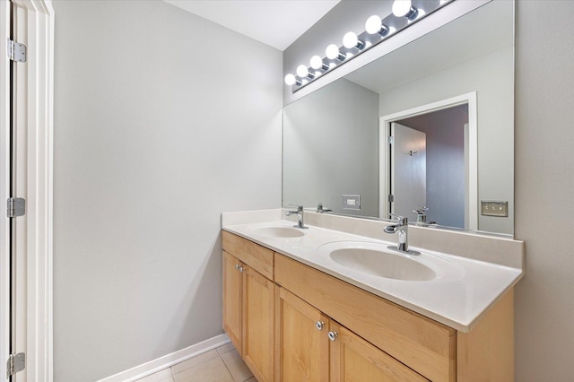 bathroom with tile patterned flooring and vanity