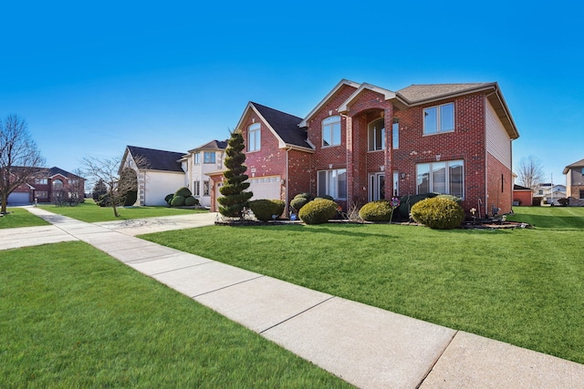 view of front of property with a garage and a front lawn