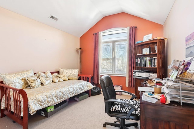 carpeted bedroom with vaulted ceiling