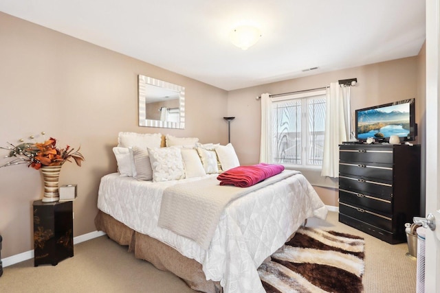 bedroom with light colored carpet