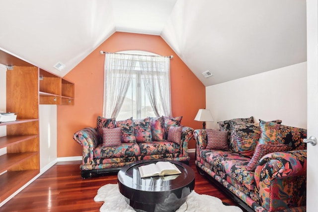 living room featuring vaulted ceiling and dark wood-type flooring