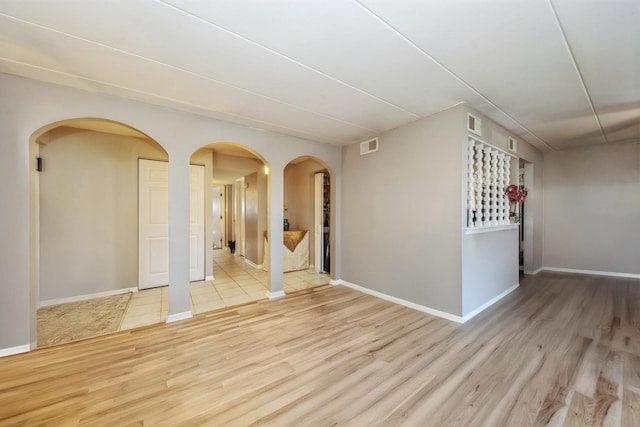 spare room with light wood-type flooring