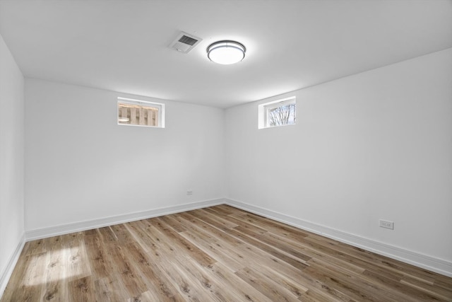 basement featuring light wood-type flooring