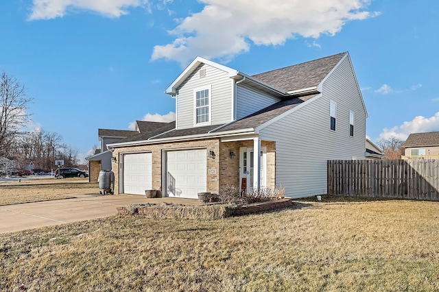 front facade with a garage and a front lawn