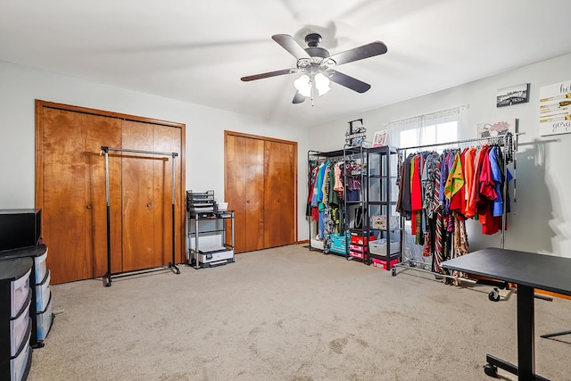 misc room featuring ceiling fan and light colored carpet