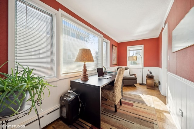 office space featuring parquet floors, ornamental molding, and baseboard heating