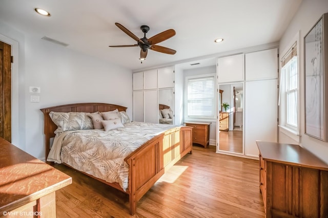 bedroom with ceiling fan and light hardwood / wood-style floors