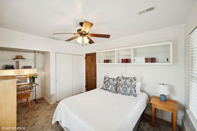 carpeted bedroom with a closet and ceiling fan