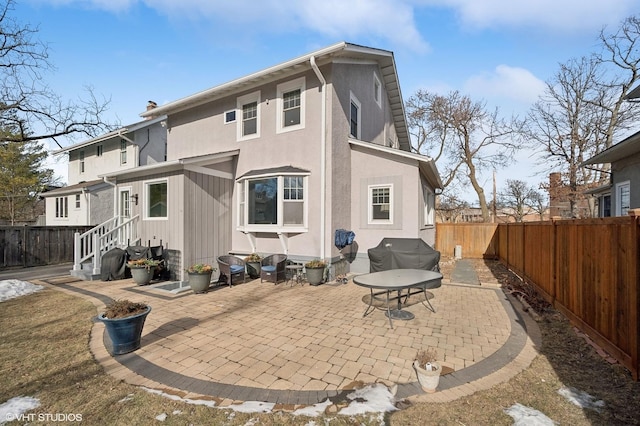 rear view of house with a patio area