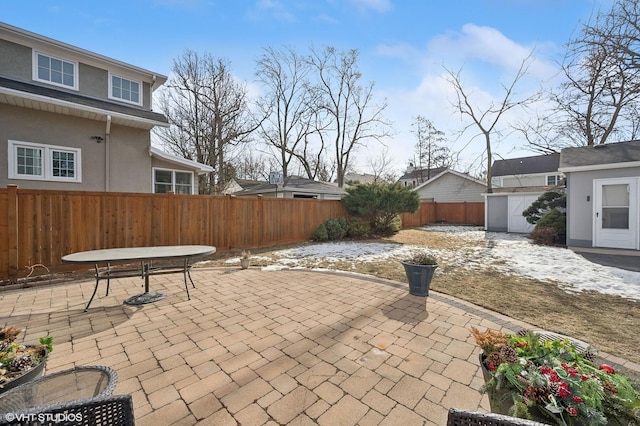 view of patio / terrace featuring a shed