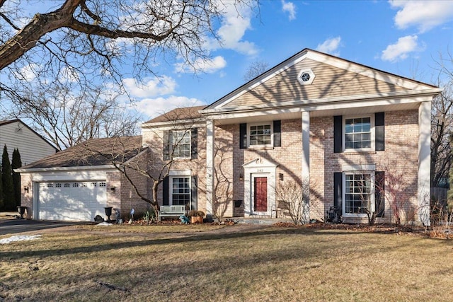 view of front of home featuring a garage and a front lawn