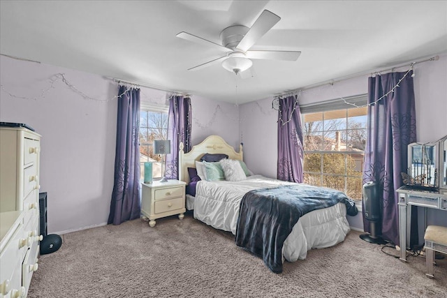 bedroom with ceiling fan and carpet