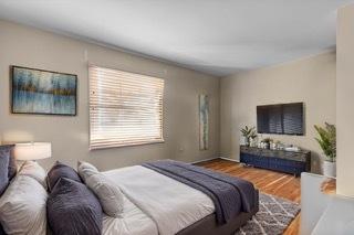 bedroom with wood-type flooring