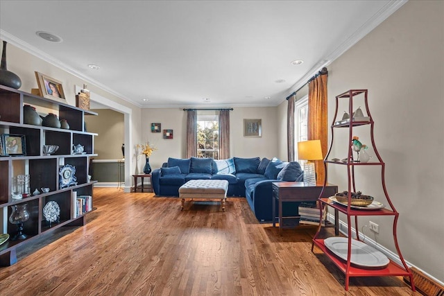 living room featuring wood-type flooring and ornamental molding