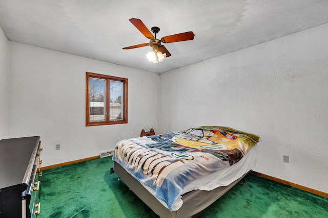 bedroom featuring dark carpet and ceiling fan