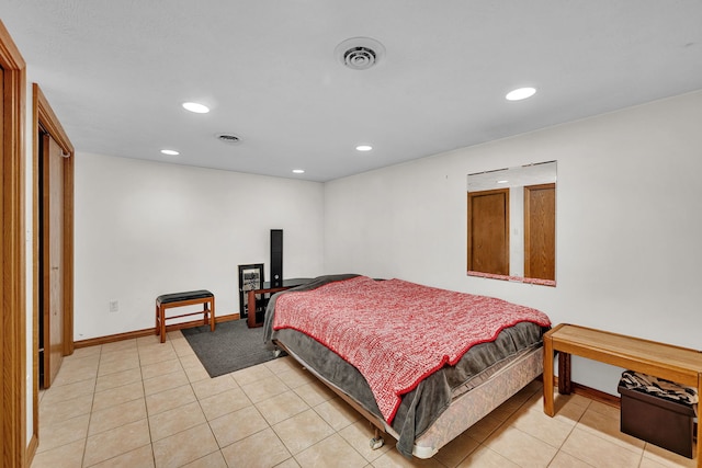 bedroom featuring light tile patterned flooring