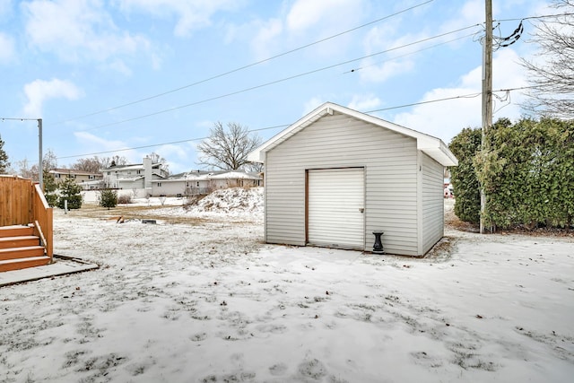 view of snow covered garage