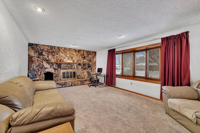 carpeted living room with a fireplace and a textured ceiling