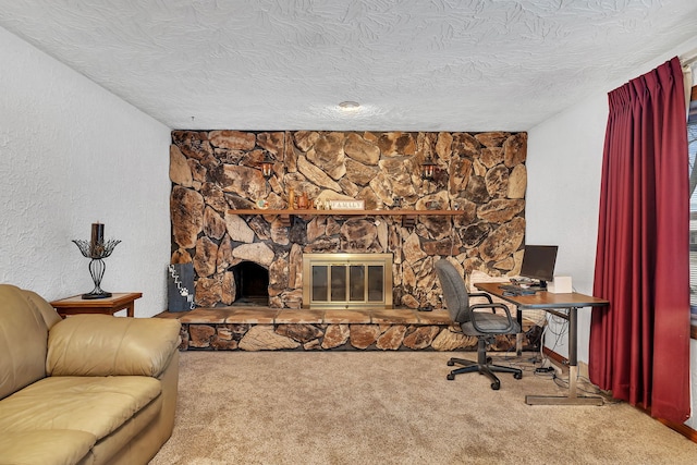 office space with a fireplace, carpet, and a textured ceiling