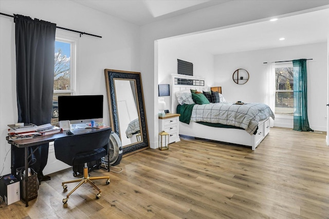 bedroom with light hardwood / wood-style flooring