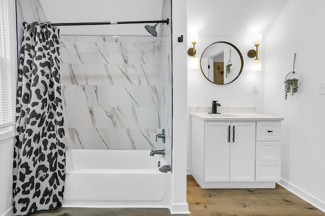 bathroom with vanity, hardwood / wood-style floors, and shower / bath combo with shower curtain