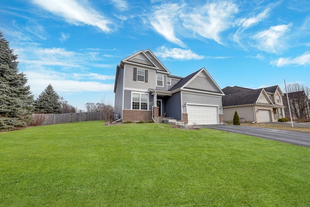 view of front of house with a garage and a front lawn