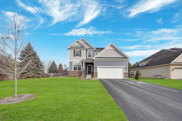 craftsman-style home with a garage and a front lawn