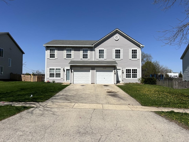 view of front facade featuring a garage and a front yard