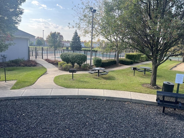 view of home's community featuring a lawn