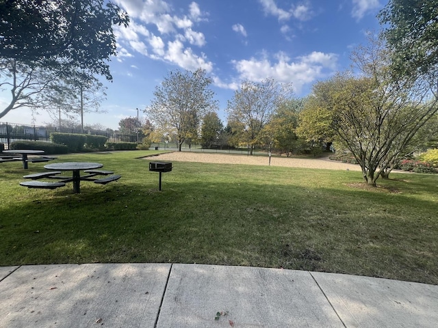 view of community with a yard and volleyball court