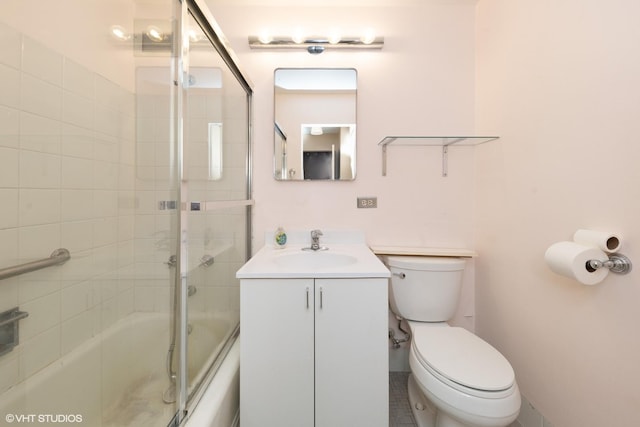 full bathroom with toilet, vanity, and shower / bath combination with glass door