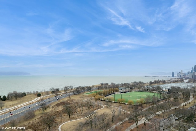 birds eye view of property with a water view