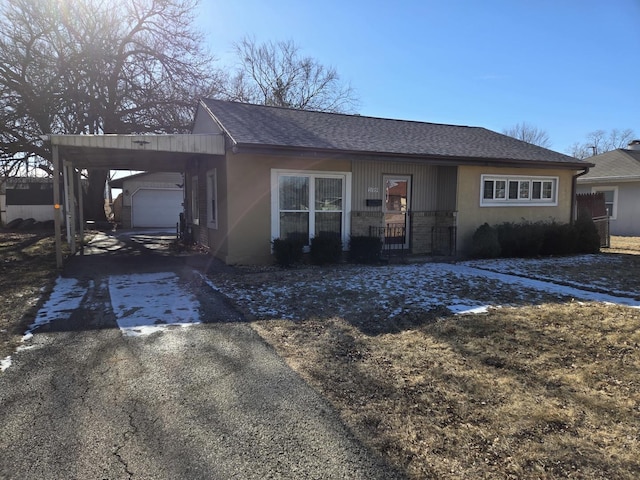 ranch-style house featuring a carport