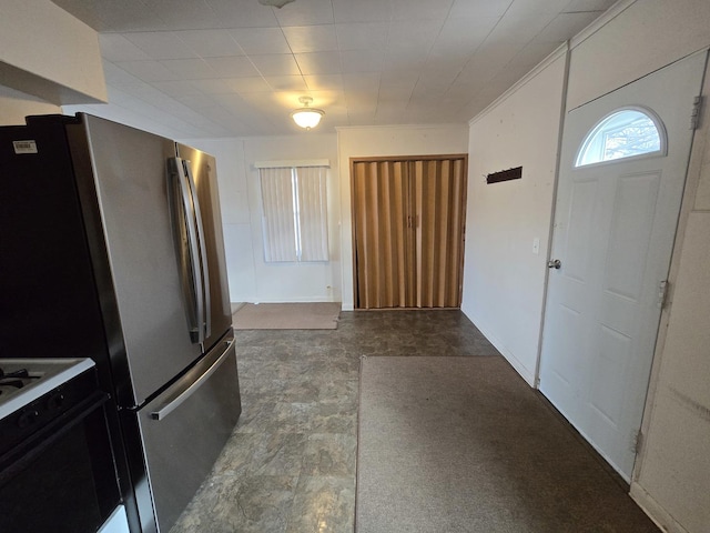 kitchen featuring stainless steel fridge and range with gas stovetop