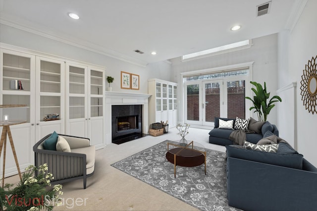 carpeted living room featuring crown molding and a fireplace